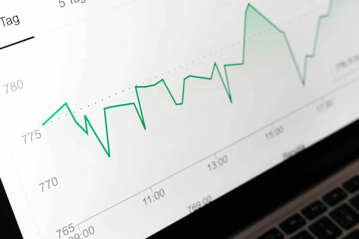 Close-up of a line chart on a laptop screen, the kind of metric trend a classification report feeds