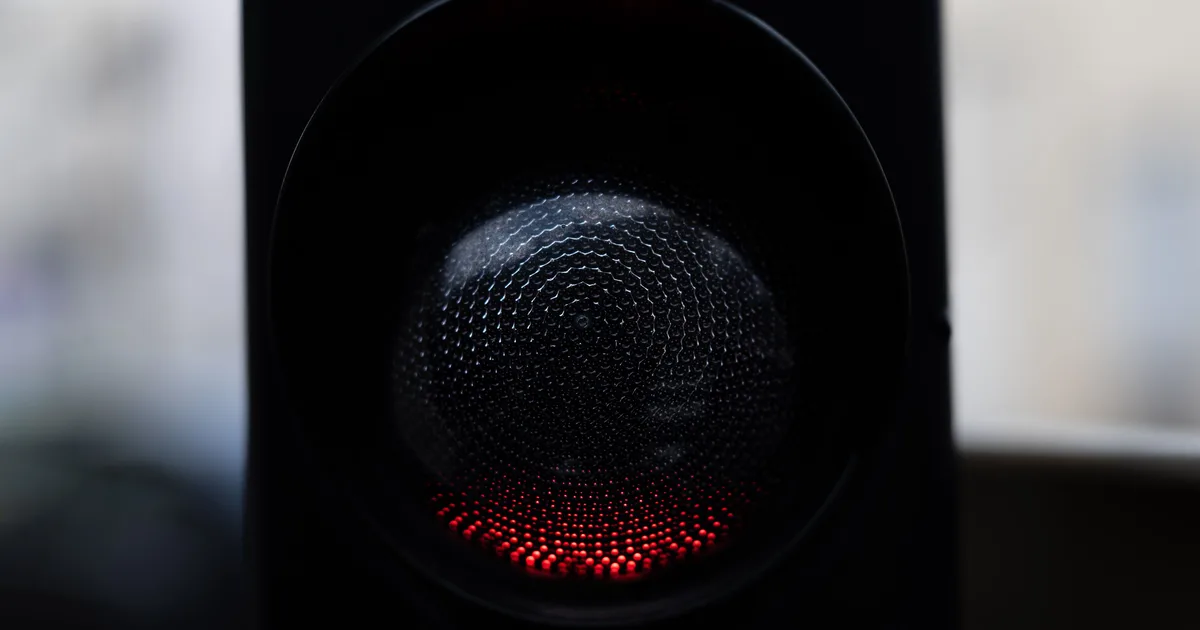 Close-up of a glowing red traffic light, a visual stand-in for the Claude AI rate exceeded error that stops a conversation