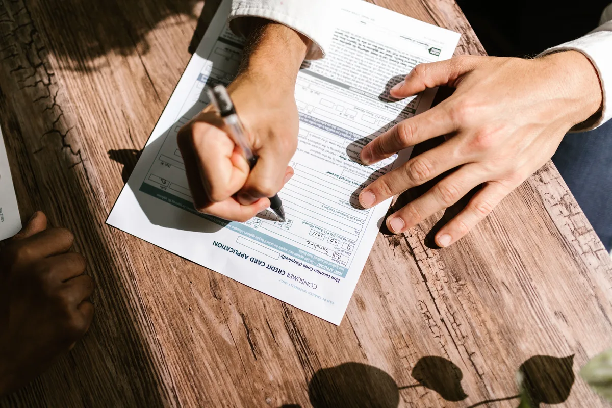 Applicant filling in a consumer credit card application, the kind of credit decision explainable AI in finance has to justify