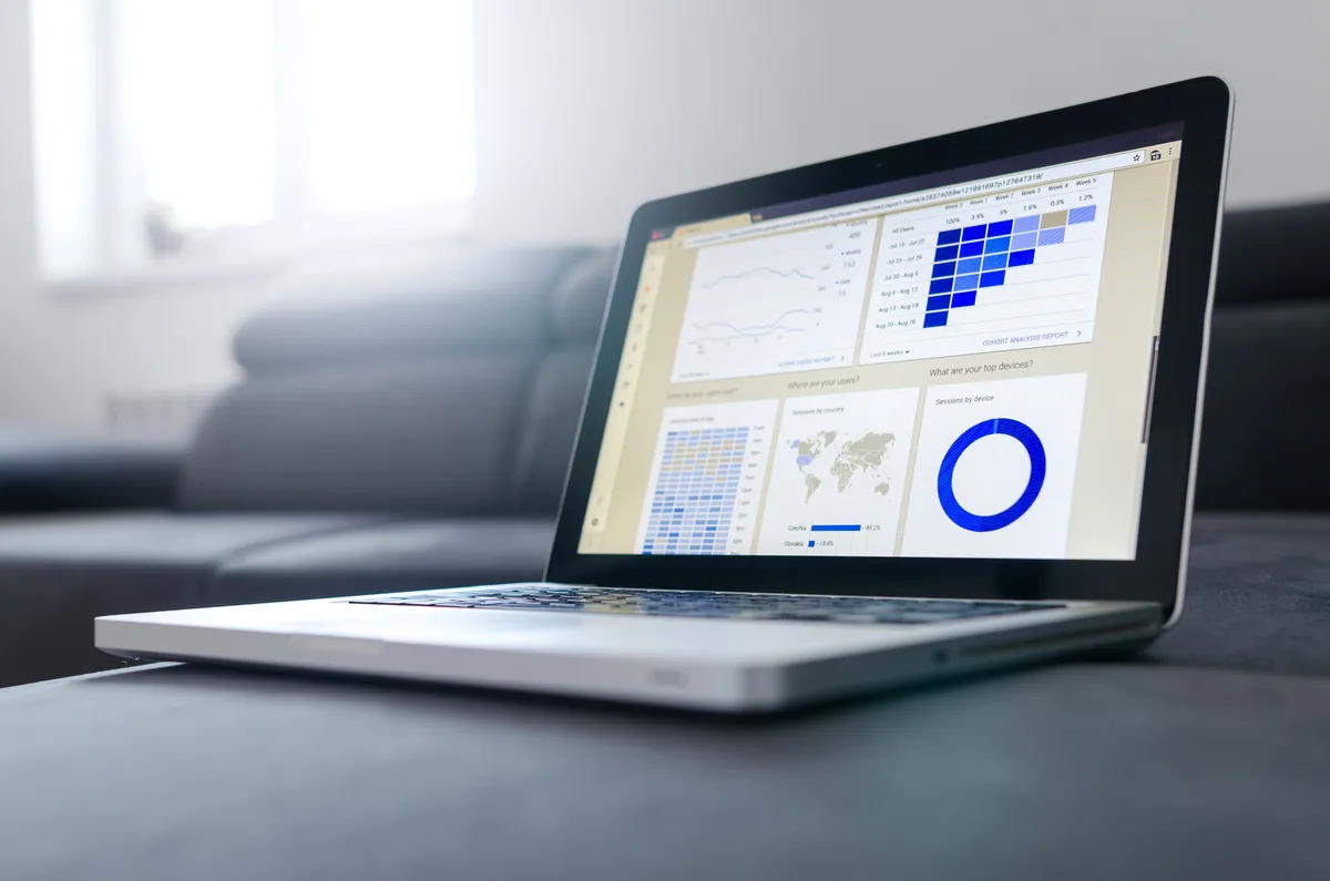 Laptop showing analytics charts, the kind of dashboard LLMOps teams use for LLM monitoring
