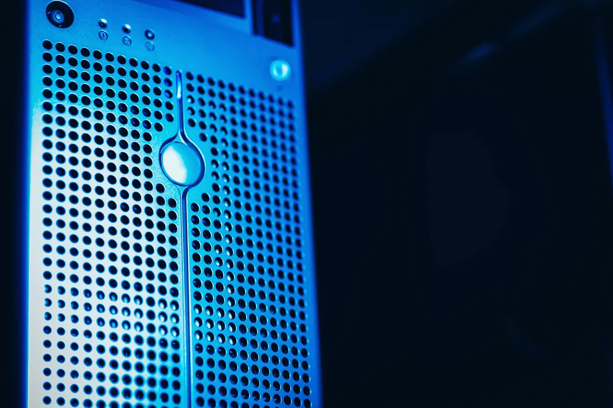 Server racks lit blue in a data centre, the hardware behind LLM training runs